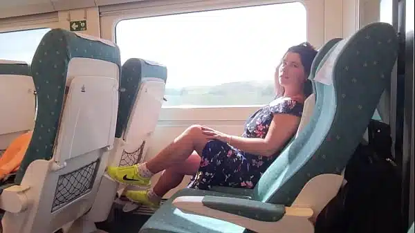Young milf seduces voyeur on public train.