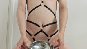 Degraded femboy installs horse buttplug on his string lingerie, eats his own cum and still wants…