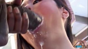 She is capable of accommodating large black male genitalia in her orifices of Asian descent, resulting in ejaculation onto her facial region