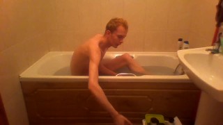Blonde teen takes a warm bath in the bathtub