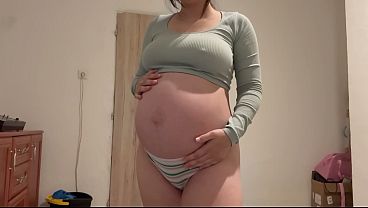 Pregnant Indian stepsister goes into the bathroom and shows off her big belly, then masturbates and plays with her pussy until she has an orgasm. She does a camel toe pussy and plays with her belly to